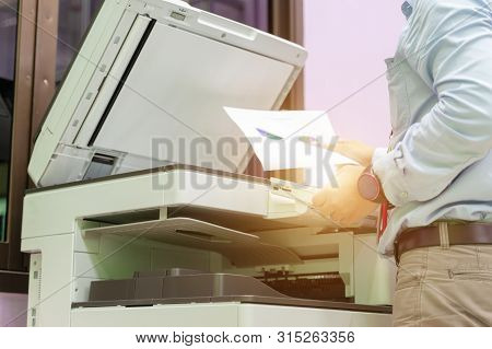Men Press The Button Of The Copier. Man Copying Paper From Photocopier. Men Use Printing Machines. T