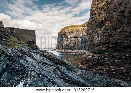 Steep Cliffs And Rocks Protect The Entrance To Whaligoe Harbour Near Wick In Caithness In Scotland