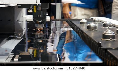 Industrial Laser Machine Cutting Metal, Robotic Mechanism Sample At The International Exhibition, Te