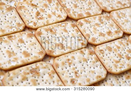 Tuc Original Snack Crackers Lies On Market Table Stacked In Big Pile