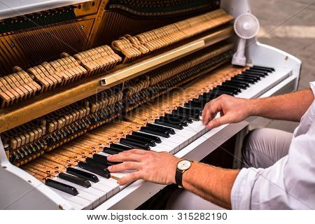 Hands Man Playing The Piano