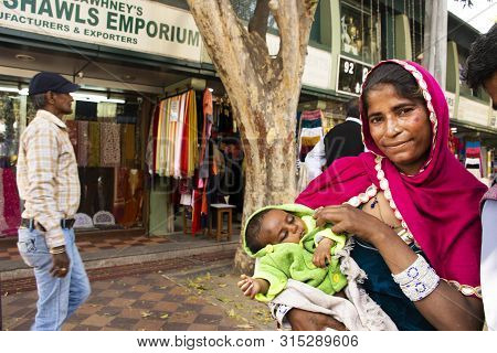 Indian Women Beggar Or Untouchables Caste Hold Baby And Begging Money From Travelers People At Janpa