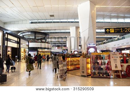 Indian People And Foreign Travelers Walking Waiting And Shopping In Shop Inside Of Indira Gandhi Int