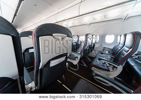 Airplane Seats And Windows. Economy Class Comfortable Seats Without Passengers. New Low-cost Carrier