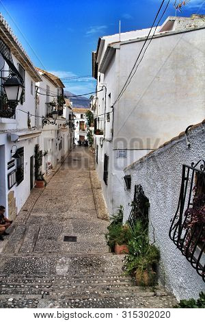 Altea, Alicante, Spain- September 19, 2018:narrow Streets And Beautiful White Facades In A Sunny Day
