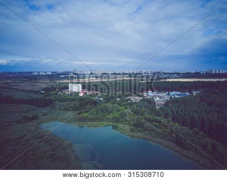 Large Lake On A Sunny Day Against The Background Of A Dense Green Forest, Nature In Russia