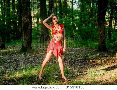 Desire. Wild Woman In Forest. Sexy Girl In Leather Clothes. Deep Forest. Cougar Female. Amazon Woman