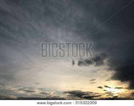 Beautiful Sky Painted By The Sun Leaving Bright Golden Shades.dense Clouds In Twilight Sky In Evenin