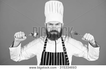 Lets Try Dish. Hungry Chef Ready To Try Food. Time To Try Taste. Chef Serious Strict Face Hold Spoon
