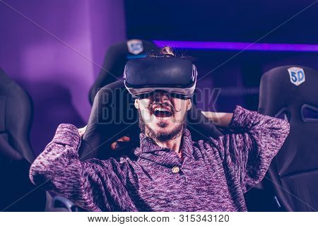 Man In Virtual Glasses Is Watching A Movie In 5D In A Cinema