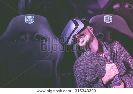 Man In Virtual Glasses Is Watching A Movie In 5D In A Cinema