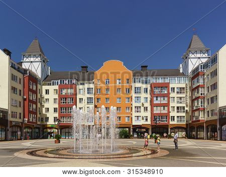 German Village, Krasnodar, Russia - June 09, 2019: Children Play Near The Fountain In The City Squar