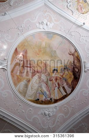 BRONNBACH, GERMANY - JULY 07, 2018: Ceiling frescoes with scenes from the life of St. Bernard of Clairvaux by Johann Adam Remele in Bernard Hall, Cistercian Abbey of Bronnbach in Reicholzheim, Germany