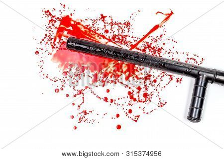 Bloody Russian Police Rubber Tonfa Baton In Blood Spatter Isolated On White Background In Top-down F