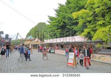 Paris France - May 26, 2019: Unidentified People Visit La Grande Halle De La Villette Amusement Park