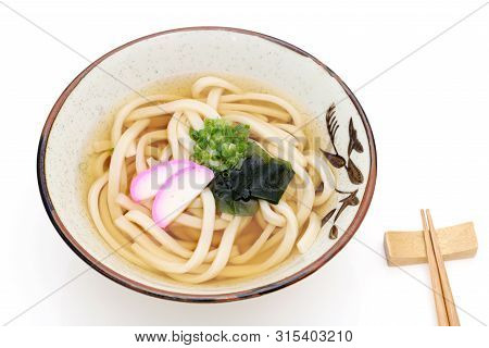 Japanese Kake Udon Noodles In A Ceramic Bowl On White Background