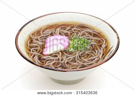 Japanese Kake Soba Noodles In A Ceramic Bowl On White Background