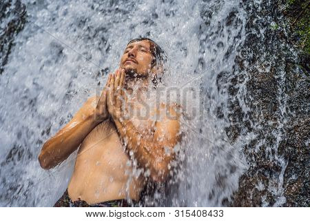 Young Man Tourist In Holy Springs Sebatu In Bali
