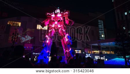 Tokyo, Japan 30 June 2019: Unicorn Gundam robot statue in odaiba at night