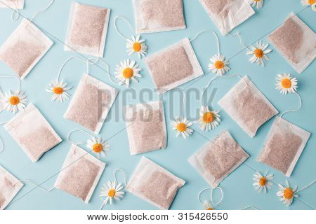 Close Up Of Tea Time. Dry Camomile Tea In The Tea Bag, Minimal Concept. Chamomile Anti-depression Be