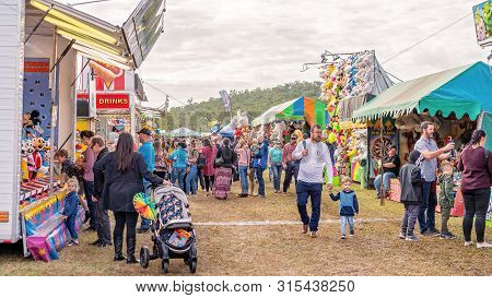Sarina, Queensland, Australia - August 2019: Crowd On Sideshow Alley Enjoying Local Country Show