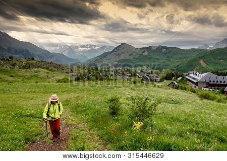 Hiker Woman With A View Of Tena Valley In The Pyrenees, Formigal,  Huesca, Spain