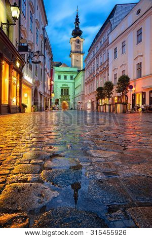 Linz, Austria. Cityscape Image Of Old Town Linz, Austria During Twilight Blue Hour With Reflection O
