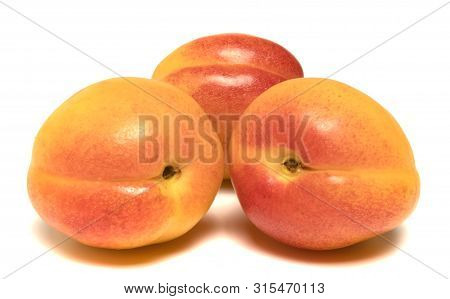 Several Apricots Beautifully Laid On A White Background