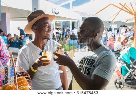 Johannesburg, South Africa - October 14 2017: African Male Friends Drinking And Generally Enjoying A