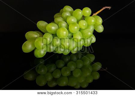Huge Bunch Of Fresh Green Grape Isolated On Black Glass
