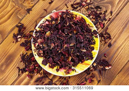 Dried Hibiscus (carcade, Roselle) On Wooden Table