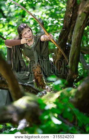 Elf Archer With A Bow In The Forest
