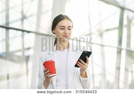 Business Woman With Phone On Street. Portrait Of Smiling Beautiful Young Female In Stylish Clothes C