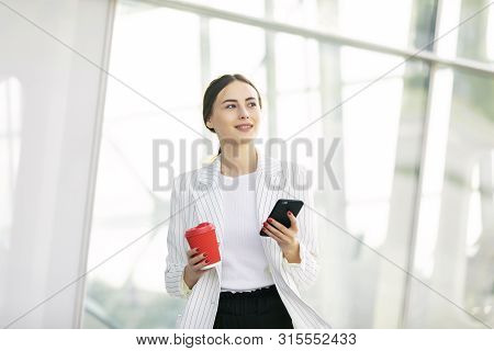 Business Woman With Phone On Street. Portrait Of Smiling Beautiful Young Female In Stylish Clothes C