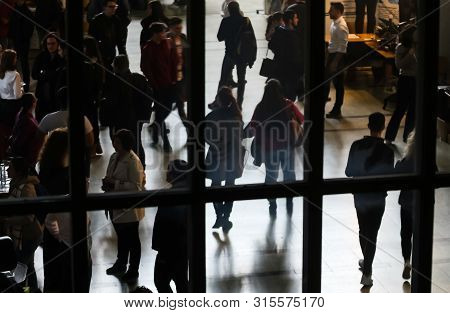 Bucharest, Romania - Novemder 07, 2018: The Silhouettes Of Students Are Seen Through A Window At A J