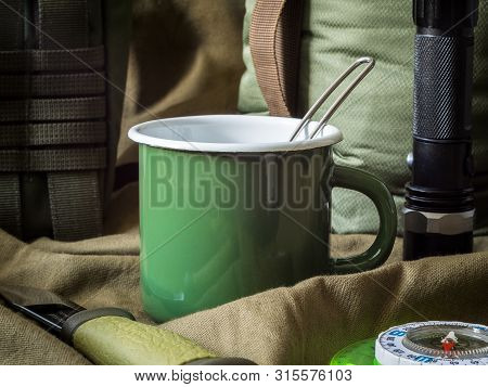 Modern Outdoor Survival Kit In Green Tones