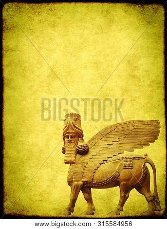 Grunge background with paper texture and lamassu - human-headed winged bull statue, Assyrian protective deity. Copy space for text. Mock up template