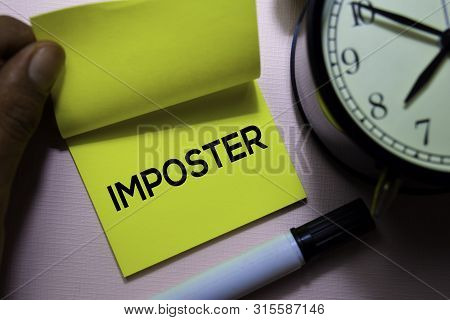 Imposter Text On Sticky Notes Isolated On Office Desk