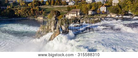 The Rhine Fall Panorama With The Rhienfall, Switzerland. (rhinefall Is The Biggest Plain Waterfall I