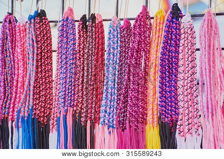 Port-la-foret, Brittany, France - July 09, 2019: Market Stall For Braided Bracelets At A Market In P
