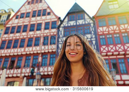 Smiling Tourist Woman In Romerberg Square, Frankfurt, Germany
