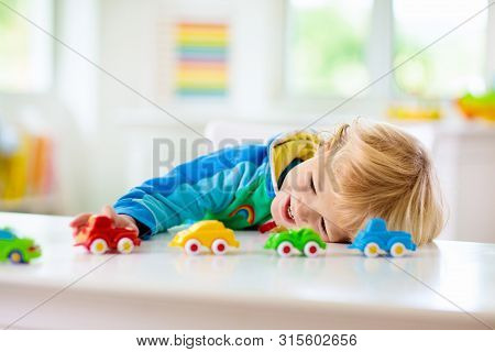 Boy Playing Toy Cars. Kid With Toys. Child And Car