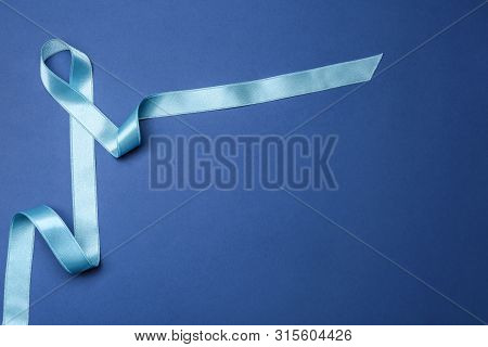 Light Blue Awareness Ribbon On Color Background, Top View With Space For Text. Symbol Of Social And 