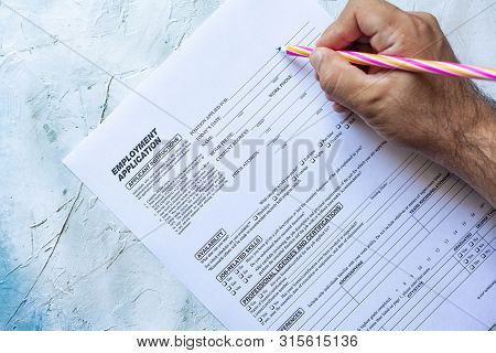Hand Filling Standard Application For Employment. Hr, Hiring, Applicant Filling Job Application. Hr,