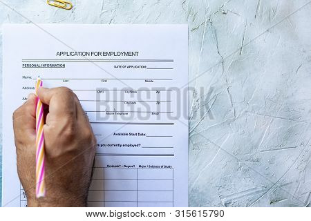 Hand Filling Standard Application For Employment. Hr, Hiring, Applicant Filling Job Application. Hr,