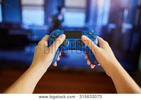 Kaliningrad, Russia -  July 26, 2019: Young Girl Holds A Remote Control From A Game Console. A Girl 