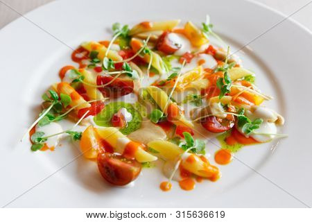Pasta alla Norma cooked in modern way, served as cold appetizer