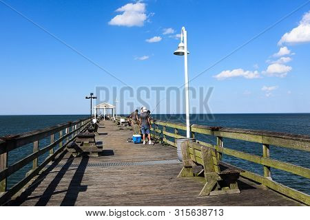 Norfolk, Virginia/usa - July 22, 2019: People Fish On The Ocean View Pier, Extending 1690 Feet Out O