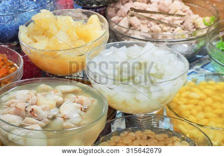 Verity Sweet Tropical Fruit, Corn, Logan , Palm, Coconut, Cantaloupe And  Taro With Syrup In Glass B