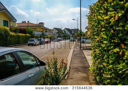 Rovigo, Italy - July, 7, 2019: cars parked on the street in Rovigo, Italy